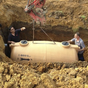 How much should be budgeted to dig a well and install a septic system?